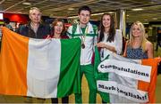 18 August 2014; Team Ireland's 800m bronze medalist Mark English with his family, from left, Joe English, father, Bridget, mother, and Joanne and Michelle, sisters, on his return from the European Athletics Championships 2014 in Zurich, Switzerland. Dublin Airport, Dublin. Picture credit: Pat Murphy / SPORTSFILE