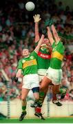 11 August 1996; Seamus Moynihan, left, and Maurice Fitzgerald, Kerry, compete for a high ball with Liam Machale, Mayo. 1996 GAA Football All-Ireland Senior Championship Semi-Final, Mayo v Kerry, Croke Park, Dublin. Picture credit: Brendan Moran / SPORTSFILE