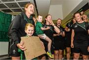 18 August 2014; Ireland captain Fiona Coghlan, with Jack Coghlan, aged 5, pictured in Dublin Airport on her return from the Women's Rugby World Cup in France. Dublin Airport, Dublin. Picture credit: Ramsey Cardy / SPORTSFILE