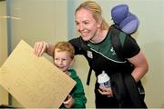 18 August 2014; Ireland's Niamh Briggs with Jack Coghlan, aged 5,  in Dublin Airport on her return from the Women's Rugby World Cup in France. Dublin Airport, Dublin. Picture credit: Ramsey Cardy / SPORTSFILE
