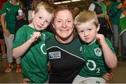 18 August 2014; Ireland's Grace Davitt is welcomed home by nephews Cian, left, and Adam O'Brien, in Dublin Airport on her return from the Women's Rugby World Cup in France. Dublin Airport, Dublin. Picture credit: Ramsey Cardy / SPORTSFILE