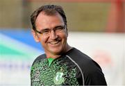 18 August 2014; Shamrock Rovers manager Pat Fenlon walks off the pitch after sections of the pitch were deemed unplayable by referee Tom Connolly. SSE Airtricity League Premier Division, Bohemians v Shamrock Rovers, Dalymount Park, Dublin. Picture credit: David Maher / SPORTSFILE