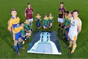 19 August 2014; U-21 stars Tony Kelly, Clare, Stephen McAfee, Antrim, Cathal Mannion, Galway, and Conor McDonald, Wexford, met today in Clanna Gael GAA Club ahead of the Bord Gáis Energy GAA Hurling U-21 All-Ireland Semi Final which take place this Saturday 23rd August in Semple Stadium, Thurles. Clare take on Ulster winners Antrim at 4pm while Galway face Leinster kingpins Wexford at 6pm. Both games will be shown live on TG4 and spectators can vote for their player of the match by using hBGE. Pictured are, from left, Clare's Tony Kelly, Galway's Cathal Mannion, Wexford's Conor McDonald and Antrim's Stephen McAfee with members of the U12 Clanna Gael GAA team. Bord Gáis Energy GAA Hurling All-Ireland U21 Championship Semi-Final Photocall, Clanna Gael Fontenoy GAA Club, Ringsend, Dublin. Picture credit: Ramsey Cardy / SPORTSFILE