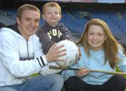 8 November 2006; Science, Sport and Education will come together at the 2006 Kellog's GAA National Coaching Conference, at the launch is Laois footballer Ross Munnelly, with children Aoife McConnell and Evan Dardis. Croke Park, Dublin. Picture credit: Pat Murphy / SPORTSFILE