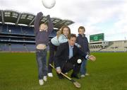 8 November 2006; Science, Sport and Education will come together at the 2006 Kellog's GAA National Coaching Conference, at the launch is expert in child physiology Professor Niall Moyna with children Aoife McConnell, Sean Dardis, right, and Evan Dardis. Croke Park, Dublin. Picture credit: Pat Murphy / SPORTSFILE