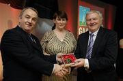 7 November 2006; President of the GAA Nickey Brennan in the company of Carolan Lennon, Director of Marketing, Vodafone, presents Tony Maher, Cork, a member of the Hurling All Stars of 1971, with a commemorative medal to mark the 35th Anniversary of the Vodafone GAA All-Star Awards scheme at a special celebration in Croke Park, Dublin. Picture credit: Ray McManus / SPORTSFILE