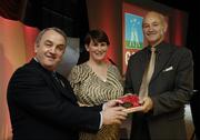 7 November 2006; President of the GAA Nickey Brennan in the company of Carolan Lennon, Director of Marketing, Vodafone, presents Pat Hartigan, Limerick, a member of the Hurling All Stars of 1971, with a commemorative medal to mark the 35th Anniversary of the Vodafone GAA All-Star Awards scheme at a special celebration in Croke Park, Dublin. Picture credit: Ray McManus / SPORTSFILE
