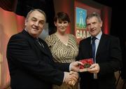 7 November 2006; President of the GAA Nickey Brennan in the company of Carolan Lennon, Director of Marketing, Vodafone, presents Tadhg O'Connor, Tipperary, a member of the Hurling All Stars of 1971, with a commemorative medal to mark the 35th Anniversary of the Vodafone GAA All-Star Awards scheme at a special celebration in Croke Park, Dublin. Picture credit: Ray McManus / SPORTSFILE