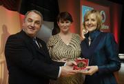 7 November 2006; President of the GAA Nickey Brennan in the company of Carolan Lennon, Director of Marketing, Vodafone, presents Madaline Cummins, on behalf of Frank, Kilkenny, a member of the Hurling All Stars of 1971, with a commemorative medal to mark the 35th Anniversary of the Vodafone GAA All-Star Awards scheme at a special celebration in Croke Park, Dublin. Picture credit: Ray McManus / SPORTSFILE