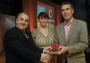 7 November 2006; President of the GAA Nickey Brennan in the company of Carolan Lennon, Director of Marketing, Vodafone, presents John Connolly, Galway, a member of the Hurling All Stars of 1971, with a commemorative medal to mark the 35th Anniversary of the Vodafone GAA All-Star Awards scheme at a special celebration in Croke Park, Dublin. Picture credit: Ray McManus / SPORTSFILE