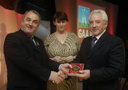 7 November 2006; President of the GAA Nickey Brennan in the company of Carolan Lennon, Director of Marketing, Vodafone, presents Francis Loughnane, Tipperary, a member of the Hurling All Stars of 1971, with a commemorative medal to mark the 35th Anniversary of the Vodafone GAA All-Star Awards scheme at a special celebration in Croke Park, Dublin. Picture credit: Ray McManus / SPORTSFILE