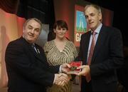 7 November 2006; President of the GAA Nickey Brennan in the company of Carolan Lennon, Director of Marketing, Vodafone, presents Ray Cummins, Cork, a member of the Hurling All Stars of 1971, with a commemorative medal to mark the 35th Anniversary of the Vodafone GAA All-Star Awards scheme at a special celebration in Croke Park, Dublin. Picture credit: Ray McManus / SPORTSFILE