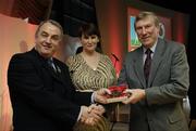 7 November 2006; President of the GAA Nickey Brennan in the company of Carolan Lennon, Director of Marketing, Vodafone, presents Donie O'Sullivan, Kerry, a member of the Football All Stars of 1971, with a commemorative medal to mark the 35th Anniversary of the Vodafone GAA All-Star Awards scheme at a special celebration in Croke Park, Dublin. Picture credit: Ray McManus / SPORTSFILE