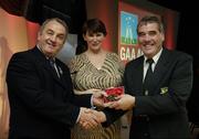 7 November 2006; President of the GAA Nickey Brennan in the company of Carolan Lennon, Director of Marketing, Vodafone, presents Eugene Mulligan, Offaly, a member of the Football All Stars of 1971, with a commemorative medal to mark the 35th Anniversary of the Vodafone GAA All-Star Awards scheme at a special celebration in Croke Park, Dublin. Picture credit: Ray McManus / SPORTSFILE