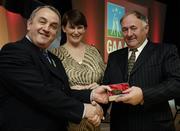 7 November 2006; President of the GAA Nickey Brennan in the company of Carolan Lennon, Director of Marketing, Vodafone, presents Pat Reynolds, Meath, a member of the Football All Stars of 1971, with a commemorative medal to mark the 35th Anniversary of the Vodafone GAA All-Star Awards scheme at a special celebration in Croke Park, Dublin. Picture credit: Ray McManus / SPORTSFILE