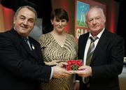 7 November 2006; President of the GAA Nickey Brennan in the company of Carolan Lennon, Director of Marketing, Vodafone, presents Tony McTague, Offaly, a member of the Football All Stars of 1971, with a commemorative medal to mark the 35th Anniversary of the Vodafone GAA All-Star Awards scheme at a special celebration in Croke Park, Dublin. Picture credit: Ray McManus / SPORTSFILE