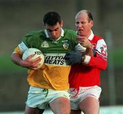 31 October 1999; James Grennan of Offaly in action against Stephen Melia of Louth during the National Football League match between Offaly and Louth at O'Connor Park in Tullamore, Offaly. Photo by Damien Eagers/Sportsfile