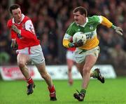 31 October 1999; Mel Keenaghan of Offaly in action against Brien Phillips of Louth during the National Football League match between Offaly and Louth at O'Connor Park in Tullamore, Offaly. Photo by Damien Eagers/Sportsfile