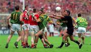 26 September 1999; Referee Michael Curley intervenes between Cork and Meath players during the GAA Football All-Ireland Senior Championship Final match between Meath and Cork at Croke Park in Dublin. Photo by Matt Browne/Sportsfile