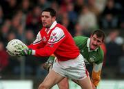 31 October 1999; Nicky Malone of Louth in action against Mel Keenaghan of Offaly during the National Football League match between Offaly and Louth at O'Connor Park in Tullamore, Offaly. Photo by Damien Eagers/Sportsfile