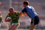 1 August 1999; Ollie Murphy of Meath is tackled by Peadar Andrews of Dublin during the Leinster Senior Football Championship Final match between Dublin and Meath at Croke Park in Dublin. Photo by Ray McManus/Sportsfile