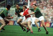 16 September 1990; Teddy McCarthy of Cork in action against Brian Stafford, right, and PJ Gillic of Meath during the All-Ireland Senior Football Championship Final match between Cork and Meath at Croke Park in Dublin. Photo by Ray McManus/Sportsfile