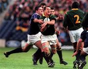 3 October 1999; Robbie Fleck of South Africa is tackled by Scott Murray of Scotland during the Rugby World Cup Pool A match between Scotland and South Africa at Murrayfield Stadium in Edinburgh, Scotland. Photo by Matt Browne/Sportsfile