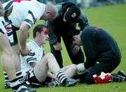 12 November 2006; Conal McCluskey, Kevin Lynch's, is attended to by medical staff while team-mate Geoffrey McGonigle checks on his condition. AIB Ulster Senior Hurling Championship Final Replay, Cushendall v Kevin Lynch's, Casement Park, Belfast. Picture credit: Russell Pritchard / SPORTSFILE