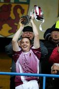 12 November 2006; Aiden DeLargy, Cushendall, lifts the Four Seasons Trophy. AIB Ulster Senior Hurling Championship Final Replay, Cushendall v Kevin Lynch's, Casement Park, Belfast. Picture credit: Russell Pritchard / SPORTSFILE