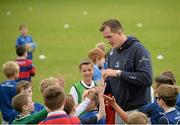 20 August 2014; Leinster and Ireland rugby player Devin Toner greets participants during The Herald Leinster Rugby Summer Camps in Clontarf RFC, Dublin. Picture credit: Piaras O Midheach / SPORTSFILE