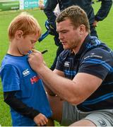 20 August 2014; Samuel Penew Palow, aged 7, gets an autograph from Leinster and Ireland rugby player Jack McGrath during The Herald Leinster Rugby Summer Camps in Clontarf RFC, Dublin. Picture credit: Piaras O Midheach / SPORTSFILE