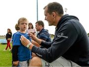 20 August 2014; Oisin Devery, aged 7, gets an autograph from Leinster and Ireland rugby player Devin Toner during The Herald Leinster Rugby Summer Camps in Clontarf RFC, Dublin. Picture credit: Piaras O Midheach / SPORTSFILE