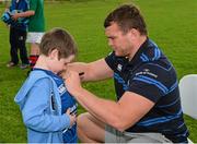 20 August 2014; Adam Lynch, aged 8, from Ballybough, gets an autograph from Leinster and Ireland rugby player Jack McGrath during The Herald Leinster Rugby Summer Camps in Clontarf RFC, Dublin. Picture credit: Piaras O Midheach / SPORTSFILE