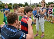 20 August 2014; Donal Hanrahan, aged 10, from Clontarf, gets an autograph from Leinster and Ireland rugby player Jack McGrath during The Herald Leinster Rugby Summer Camps in Clontarf RFC, Dublin. Picture credit: Piaras O Midheach / SPORTSFILE