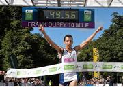 23 August 2014; Andrew Douglas, Scotland, crosses the finish line to win the Frank Duffy 10 Mile SSE Airtricity Dublin Race Series 2014. Phoenix Park, Dublin. Picture credit: Pat Murphy / SPORTSFILE