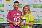 23 August 2014; Andrew Douglas, Scotland, is presented with the trophy by Leanne Sheil, Marketing Executive, SSE Airtricity, after winning the Frank Duffy 10 Mile SSE Airtricity Dublin Race Series 2014. Phoenix Park, Dublin. Picture credit: Pat Murphy / SPORTSFILE