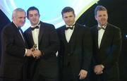10 November 2006; Aidan O'Mahony, Kerry, receives his award from An Taoiseach Bertie Ahern, TD, in the company of Dessie Farrell, Chief Executive, GPA and Dave Sheerin, Opel Ireland, at the 2006 Opel GPA Player of the Year Awards. Gaelic Player Assoication Awards, Citywest Hotel, Dublin. Picture credit: Pat Murphy / SPORTSFILE