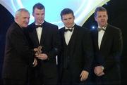 10 November 2006; Ronan Clarke, Armagh, receives his award from An Taoiseach Bertie Ahern, TD, in the company of Dessie Farrell, Chief Executive, GPA and Dave Sheerin, Opel Ireland, at the 2006 Opel GPA Player of the Year Awards. Gaelic Player Assoication Awards, Citywest Hotel, Dublin. Picture credit: Pat Murphy / SPORTSFILE