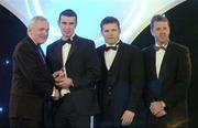 10 November 2006; Brian Murphy, Cork, receives his award from An Taoiseach Bertie Ahern, TD, in the company of Dessie Farrell, Chief Executive, GPA and Dave Sheerin, Opel Ireland, at the 2006 Opel GPA Player of the Year Awards. Gaelic Player Assoication Awards, Citywest Hotel, Dublin. Picture credit: Pat Murphy / SPORTSFILE