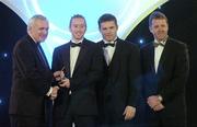 10 November 2006; James 'Cha' Fitzpatrick, Kilkenny, receives his award from An Taoiseach Bertie Ahern, TD, in the company of Dessie Farrell, Chief Executive, GPA and Dave Sheerin, Opel Ireland, at the 2006 Opel GPA Player of the Year Awards. Gaelic Player Assoication Awards, Citywest Hotel, Dublin. Picture credit: Pat Murphy / SPORTSFILE