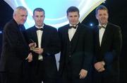 10 November 2006; Ben O'Connor, Cork, receives his award from An Taoiseach Bertie Ahern, TD, in the company of Dessie Farrell, Chief Executive, GPA and Dave Sheerin, Opel Ireland, at the 2006 Opel GPA Player of the Year Awards. Gaelic Player Assoication Awards, Citywest Hotel, Dublin. Picture credit: Pat Murphy / SPORTSFILE