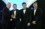 10 November 2006; Joe Deane, Cork, receives his award from An Taoiseach Bertie Ahern, TD, in the company of Dessie Farrell, Chief Executive, GPA and Dave Sheerin, Opel Ireland, at the 2006 Opel GPA Player of the Year Awards. Gaelic Player Assoication Awards, Citywest Hotel, Dublin. Picture credit: Pat Murphy / SPORTSFILE