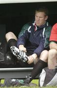 14 November 2006; Paul O'Connell puts on his boots before Ireland rugby squad training. St. Gerard's School, Bray, Co. Wicklow. Picture credit: Pat Murphy / SPORTSFILE