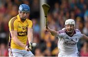 23 August 2014; Jack Guiney, Wexford, shoots to score his side's first goal despite the attention of John Hanbury, Galway. Bord Gáis Energy GAA Hurling Under 21 All-Ireland Championship, Semi-Final, Galway v Wexford, Semple Stadium, Thurles, Co. Tipperary. Picture credit: Stephen McCarthy / SPORTSFILE