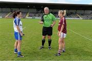 23 August 2014; Referee Keith Delahunty performs the coin toss in the company of team captains Sinead Burke, right, Galway, and Christina Reilly, Monaghan, ahead of the game. TG4 All-Ireland Ladies Football Senior Championship, Quarter-Final, Galway v Monaghan, St Brendan's Park, Birr, Co. Offaly. Picture credit: Brendan Moran / SPORTSFILE