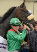 24 August 2014; Jockey Shane Foley with Raydara in the winners enclosure after winning the Debutante Stake. Curragh Racecourse, The Curragh, Co. Kildare. Picture credit: Barry Cregg / SPORTSFILE