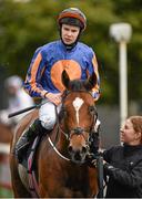 24 August 2014; Joseph O'Brien, on Gleneagles, being lead into the winners enclosure after winning the Galileo European Breeders Fund Futurity Stakes. Curragh Racecourse, The Curragh, Co. Kildare. Picture credit: Barry Cregg / SPORTSFILE