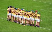 23 August 2014; The Wexford team stand together during the National Anthem before the game. Bord Gáis Energy GAA Hurling Under 21 All-Ireland Championship, Semi-Final, Galway v Wexford, Semple Stadium, Thurles, Co. Tipperary. Picture credit: Diarmuid Greene / SPORTSFILE