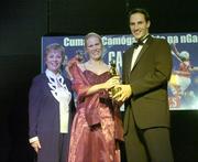 11 November 2006; Tipperary's Jovita Delaney receives her All-Star award from Tadhg Kennelly, footballer with the Sydney Swans, in the company of Liz Howard, President, Cumann Camogaiochta na nGael, speaking at the 2006 Camogie All-Star Awards. Citywest Hotel, Dublin. Picture credit: Brendan Moran / SPORTSFILE