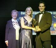 11 November 2006; Cork's Mary O'Connor receives her All-Star award from Tadhg Kennelly, footballer with the Sydney Swans, in the company of Liz Howard, President, Cumann Camogaiochta na nGael, speaking at the 2006 Camogie All-Star Awards. Citywest Hotel, Dublin. Picture credit: Brendan Moran / SPORTSFILE